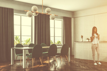 Naklejka na ściany i meble Luxury dining room kitchen, green chairs, woman