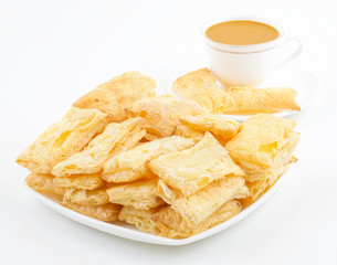 Indian Tea Time Breakfast Khari Also Know as Kharee, Khari Biscuit or Salty Puff Pastry Snacks, Served with Indian Hot Masala Chai or Hot Tea Isolated on White Background