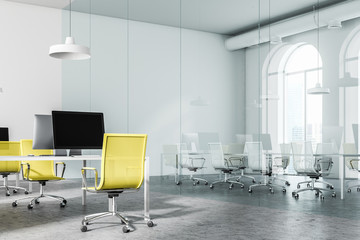 Glass meeting room and yellow chair office