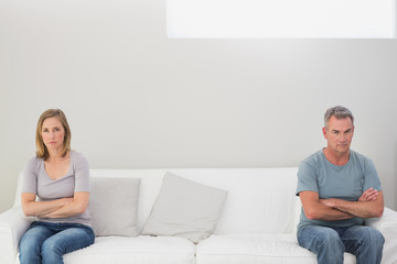 Unhappy couple not talking after an argument at home