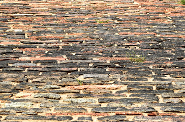 Red Brick Wall Texture Background. Close-up view of red brick wall. The wall consists of brick and cement.