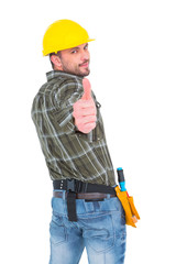 Confident manual worker gesturing thumb up