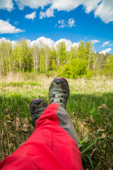 Traveler's legs against the background of nature.