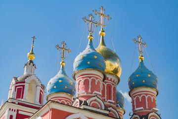 Fototapeta na wymiar Gold and blue dome of Church of St. George on blue sky background in Moscow Russia