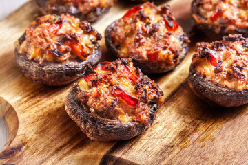 Baked champignon caps stuffed with minced meat