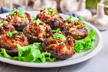 Baked champignon caps stuffed with minced meat