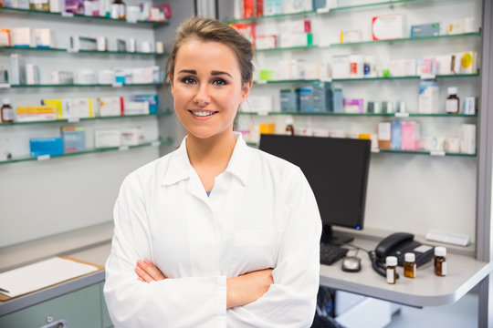 Junior pharmacist smiling at camera
