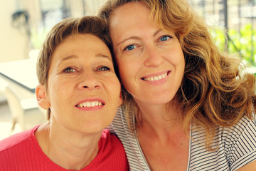 Closeup portrait attarctive mature women traveling together, have fun, smiling, lovely moments. Best friends.