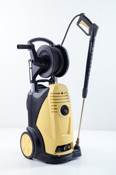 Yellow high pressure washer on white background