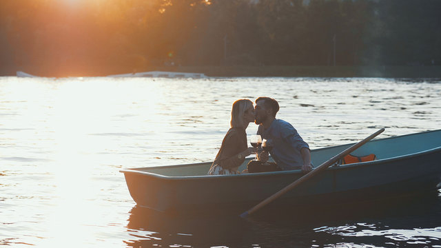Kissing young couple in a boat