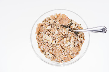 Breakfast cereal in a glass bowl isolated