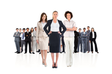 Composite image of team of businesswomen looking at camera on white background