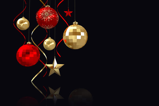 Composite image of Hanging christmas bauble decorations against black