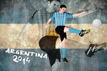 Football player in blue kicking against argentina flag in grunge effect