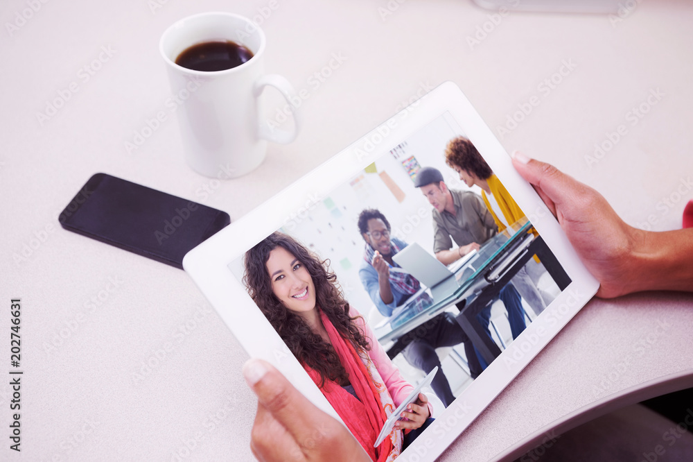 Poster composite image of smiling designer using tablet