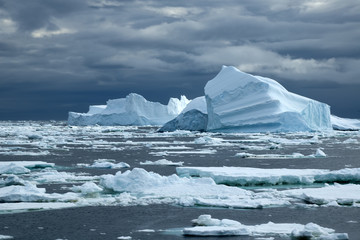 Southern Ocean, iceberg field with stormy sky