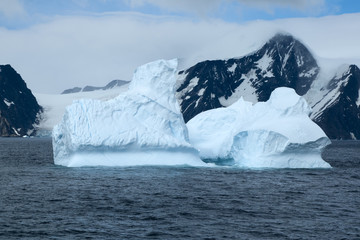 Southern Ocean Antarctica, icebergs near coastline of remote island