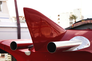 Sports boat for repairs. Exhaust pipes. The controversial car. Futuristic design. Streamlined shapes.