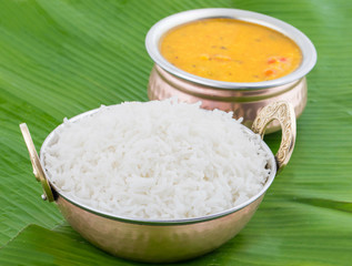 Indian Traditional Cuisine Dal Fry or Rice Also Know as Dal Chawal, Daal Chawal, Dal Rice, Whole Yellow Lentil with Rice or Dal Tadka, Daal Fry Served with Rice on Banana Leaf