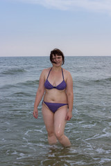 Fototapeta na wymiar a woman in the sea is standing