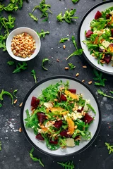 Tuinposter Fresh Beet, Orange salad with wild rocket, cheese and Pine nuts. healthy summer food © grinchh
