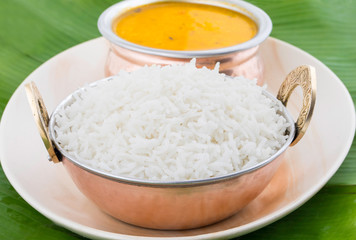 Indian Traditional Cuisine Dal Fry or Rice Also Know as Dal Chawal, Daal Chawal, Dal Rice, Whole Yellow Lentil with Rice or Dal Tadka, Daal Fry Served with Rice on Banana Leaf
