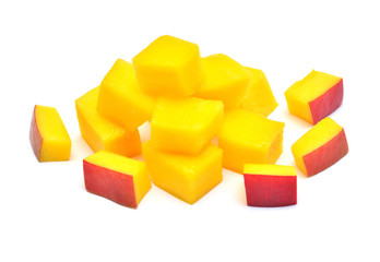 Cubes mango fruit with and without peel isolated on white background. Juicy, wholesome vitamins