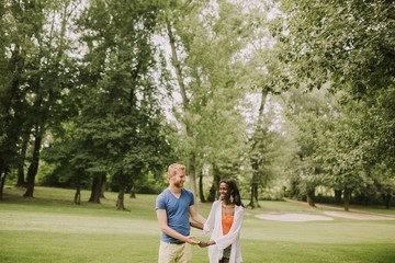 Fototapeta premium Multiracial couple in the park