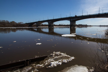 The pieces of ice floating on the river in the spring