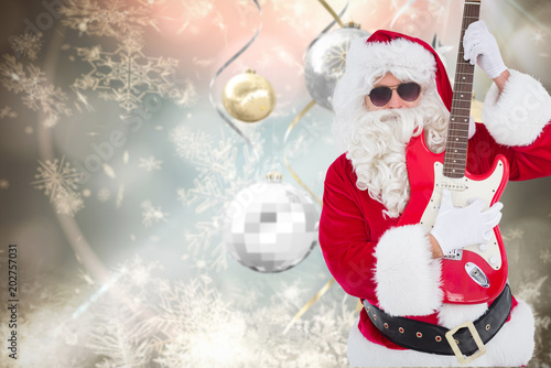 Santa With Sunglasses Playing Electric Guitar Against Hanging