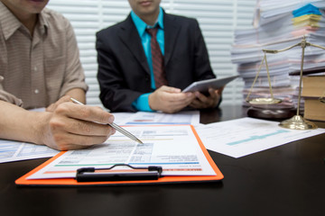 Business lawyer working about legal legislation in courtroom to help their customer