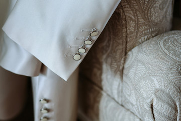 pearl buttons on the wedding jacket