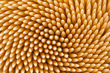 A lot of hygienic dental wooden toothpicks as background, texture (macro)