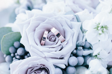 wedding rings in a bouquet of the bride