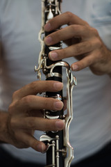 Male musician playing clarine