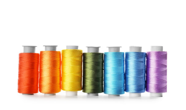 Color sewing threads on white background