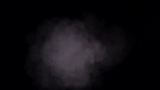 Slow moving smoke on black background