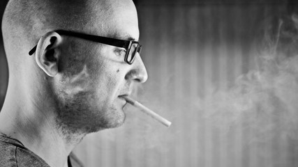 Young man smoking cigarette