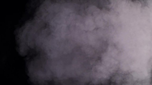 Slow moving smoke on black background