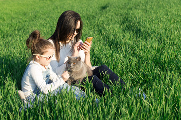 mother and daughter hugging in love playing in the park