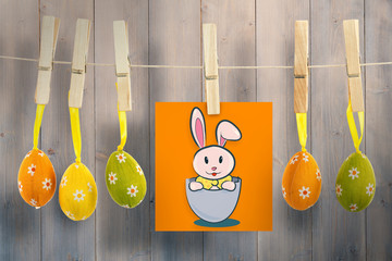easter bunny against pale grey wooden planks