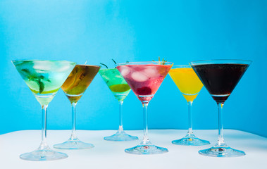Colorful cocktails against blue background