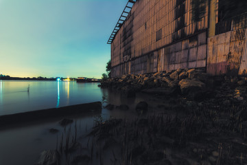 Fototapeta premium Old Warehouse on the riverside of Chao Praya River in Bangkok, Thailand