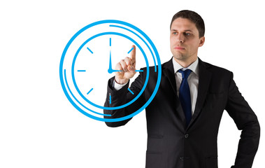 Composite image of businessman standing and pointing to a clock on white background