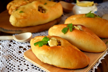 Rasstegai pie with fish filling. Traditional meal of Russian cuisine