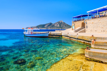 Fishing boat anchoring in Sant Elm village, Majorca island, Spain