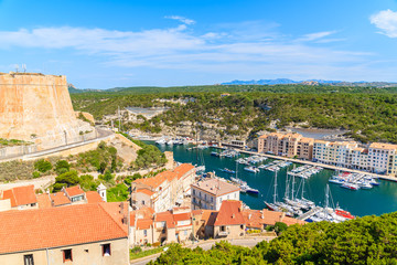 Fototapeta na wymiar View of Bonifacio port with sailing boats and colorful houses, Corsica island, France