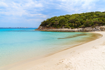 Fototapeta na wymiar Azure crystal clear water of Petit Sperone beach, Corsica island, France