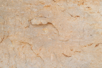 Rough rock stone texture background yellow orange natural sandstone