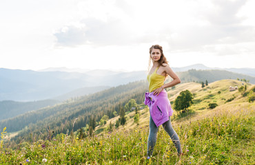 young fitness woman trail runner running on mountains top